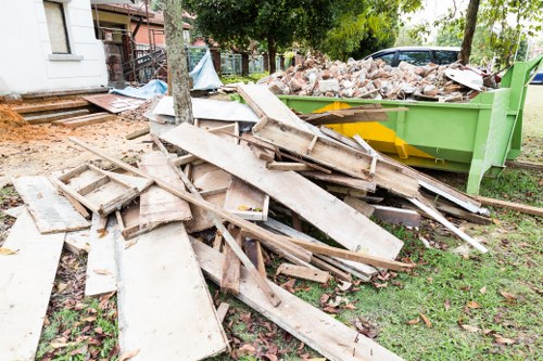 Company vehicle and skip being positioned on site
