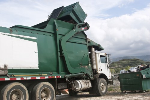 Demolition waste being loaded into a removal truck in Fulham